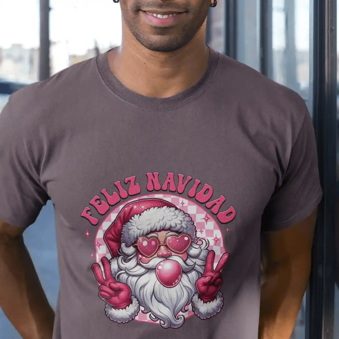 Man wearing a dark purple shirt featuring a Pink Santa Feliz Navidad DTF transfer. Perfect for custom, ready-to-press holiday apparel.