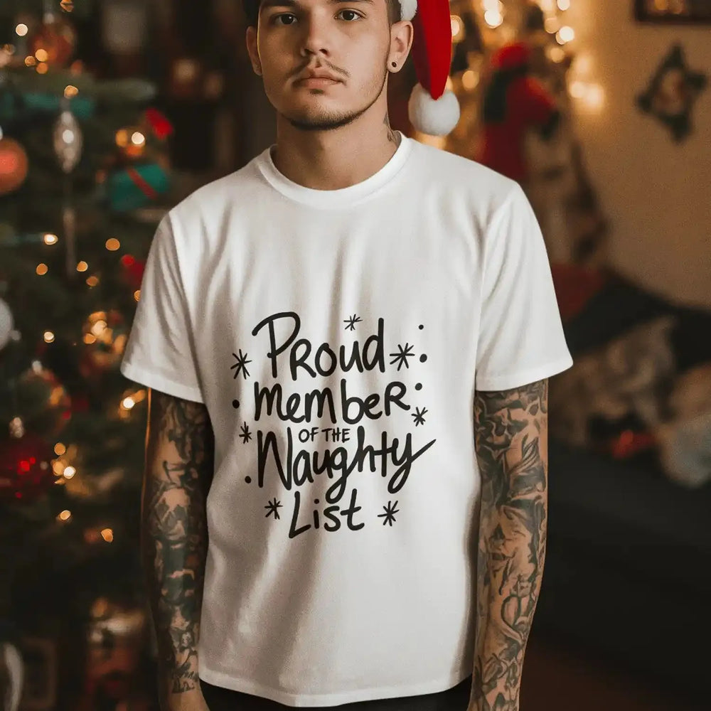 Man wearing a white shirt featuring a Proud Naughty List DTF transfer. Perfect for custom, ready-to-press holiday apparel.