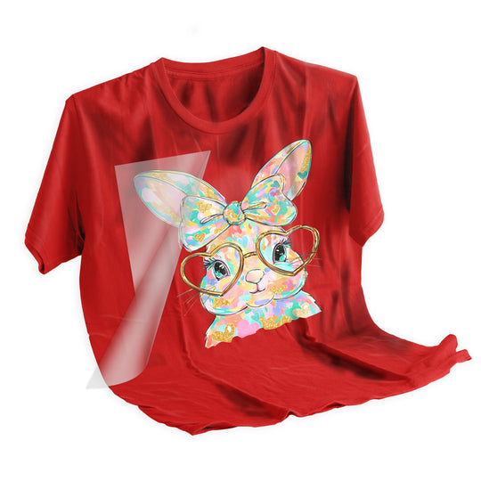 Easter bunny DTF transfer applied to light colored t-shirt showing final pressed result with vibrant colors and metallic gold details