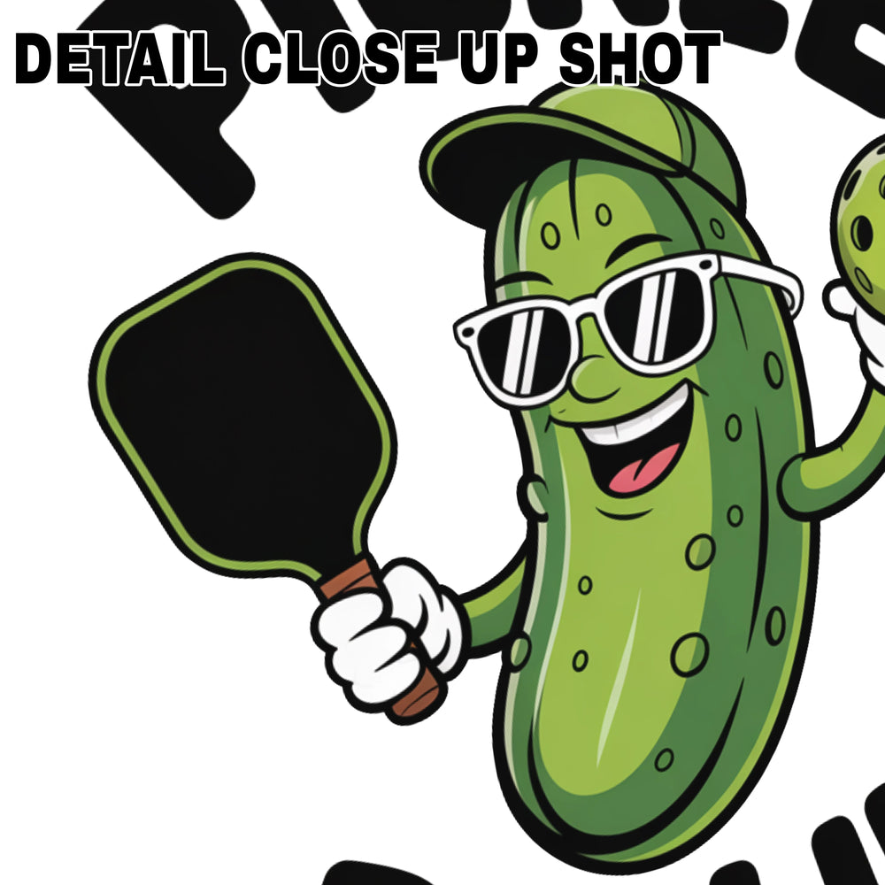 Cool pickle character DTF transfer design wearing sunglasses and baseball cap, holding pickleball paddle and ball with text Pickle Ballin