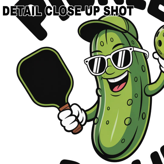 Cool pickle character DTF transfer design wearing sunglasses and baseball cap, holding pickleball paddle and ball with text Pickle Ballin