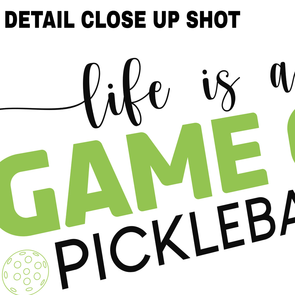 Green pickleball DTF transfer design featuring 'life is a game of pickleball' text with script and bold lettering on transparent background