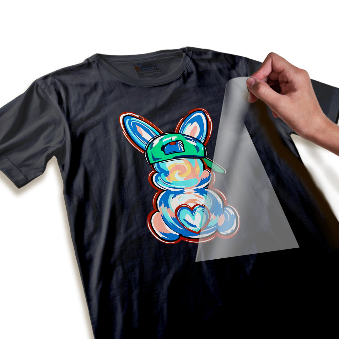 Close-up detail shot of tie-dye bunny DTF transfer showing swirl texture quality, color vibrancy, and baseball cap with heart accent