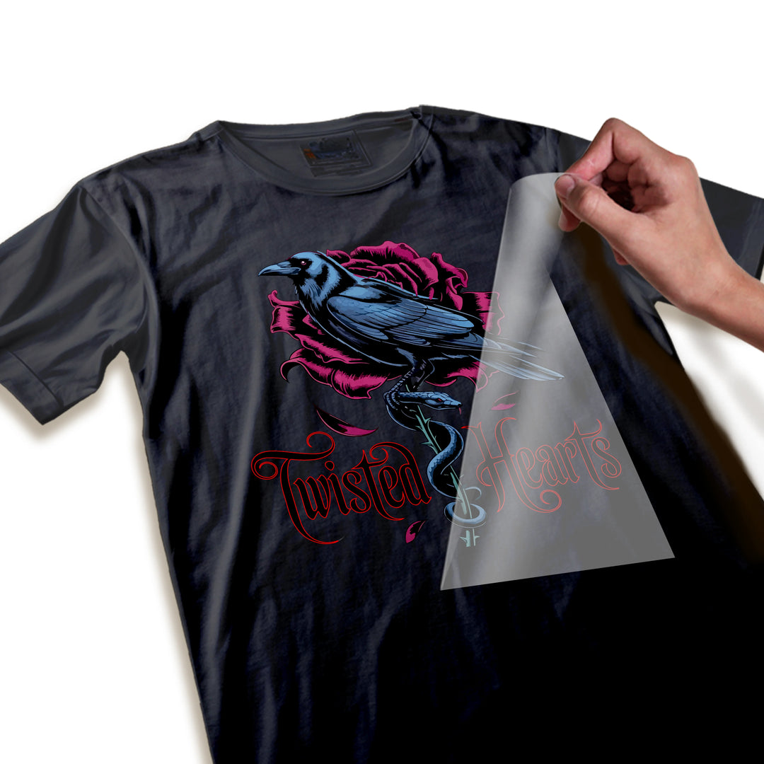 Close-up detail of twisted heart Valentine DTF transfer showing intricate rose petals, raven feathers and ornate lettering texture