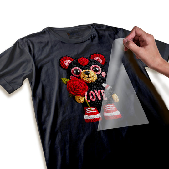 Close-up detail shot of Valentine bear DTF transfer showing yarn-like texture, rose details, and fuzzy embroidered appearance