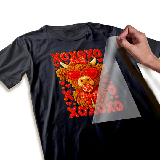 Close-up detail of Highland cow Valentine's transfer showing textured yarn-like fur pattern and dimensional bow tie elements