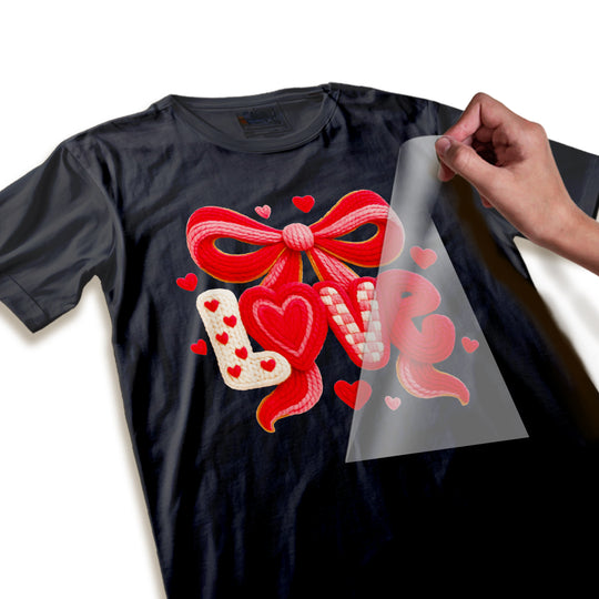 Close-up detail shot of Valentine love bow DTF transfer showing rope texture quality and dimensional heart elements