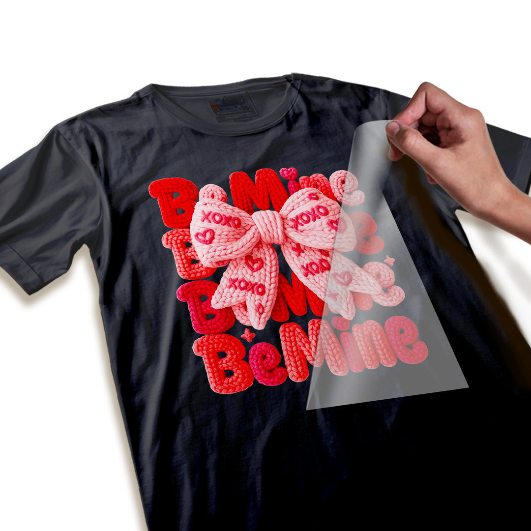 Close-up detail of Be Mine Valentine DTF transfer showing knitted rope texture and XOXO bow details