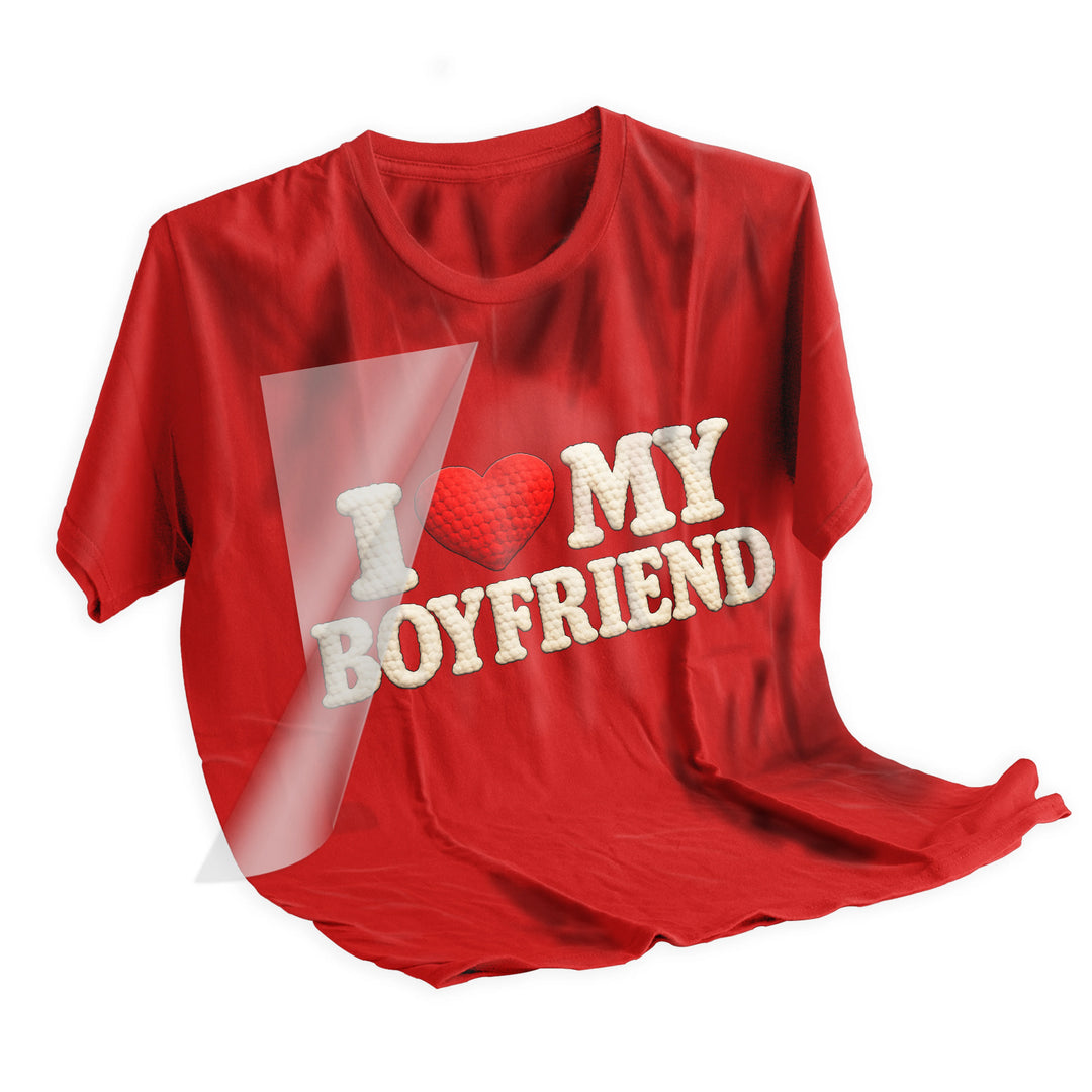 Heat press application of I Love My Boyfriend DTF transfer being applied to shirt showing proper placement and pressing technique