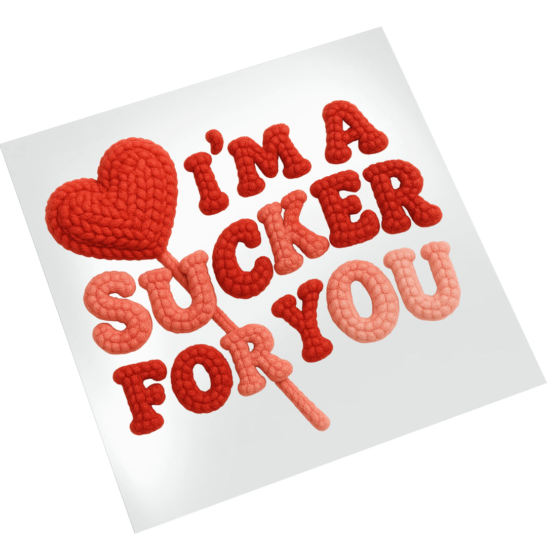 Valentine DTF transfer mockup showing Sucker For You lollipop design on white t-shirt with knitted texture effect in red colors