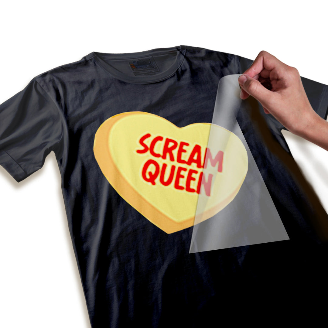 Close-up detail shot of Scream Queen candy heart DTF transfer showing texture and print quality of red text on yellow heart