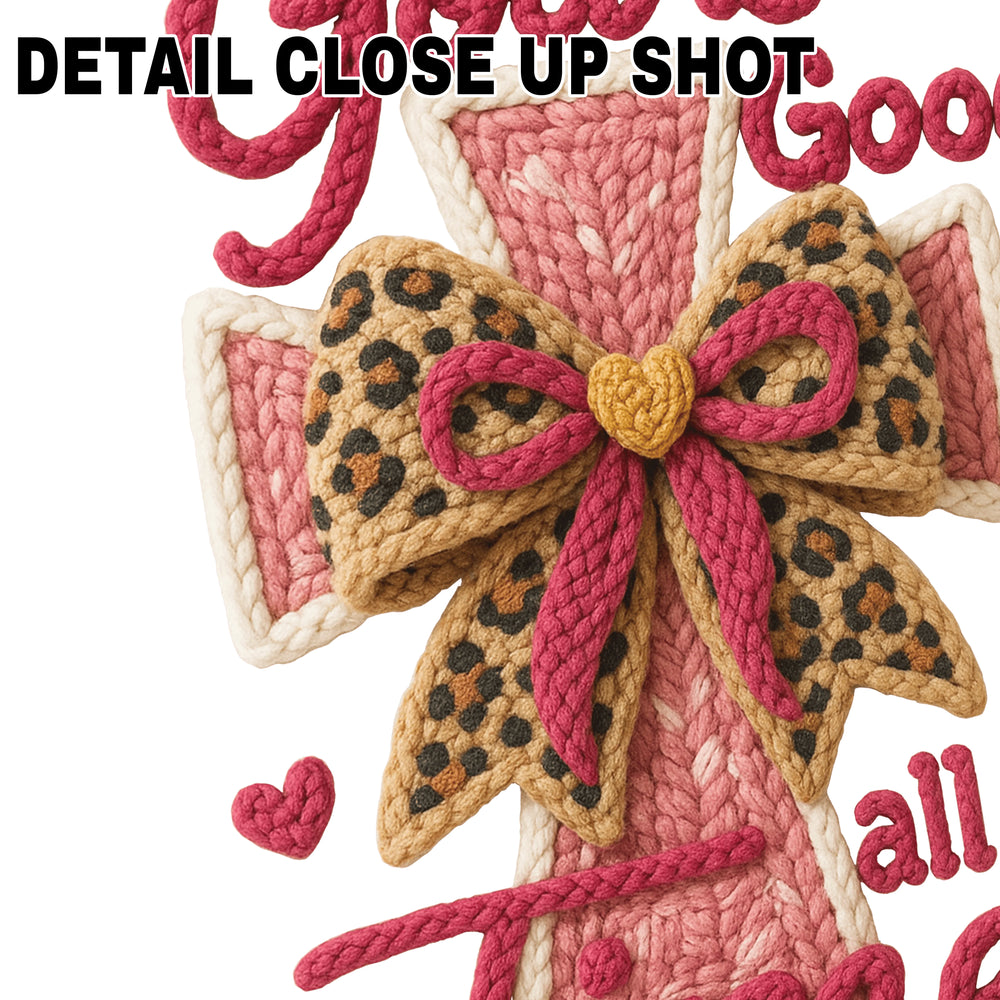 God Is Good faith DTF transfer featuring textured yarn-style cross with pink coral colors and leopard print bow accent on white background
